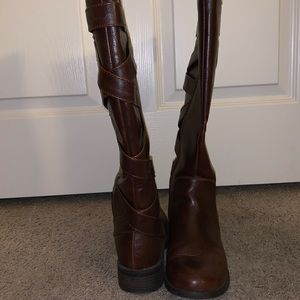 Brown faux leather zip up boats.